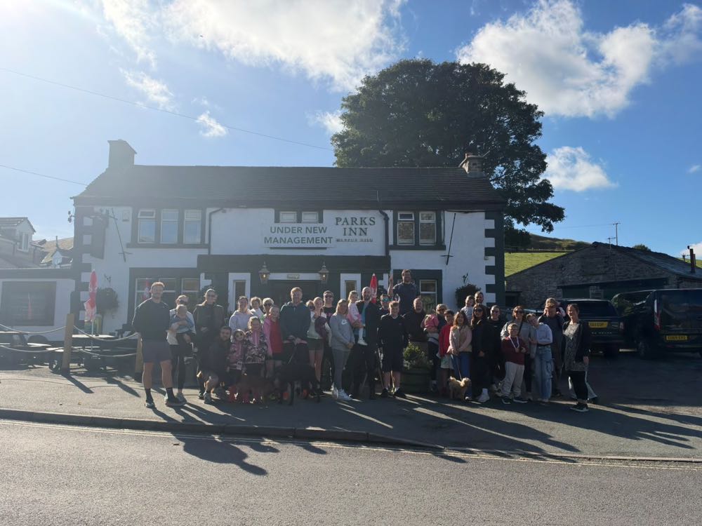 DadBodsFFC families gathered outside a pub on a club walk